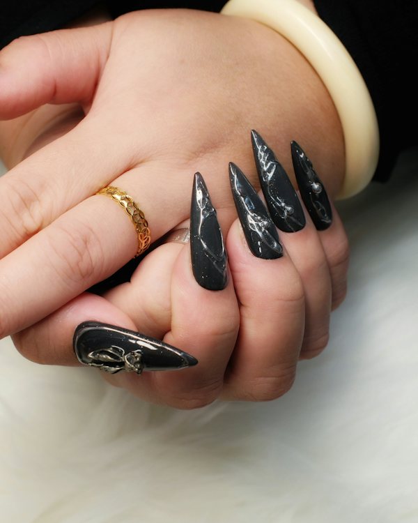 Black almond nails with spooky nail art