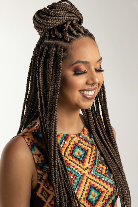 Smiling woman with long box braids