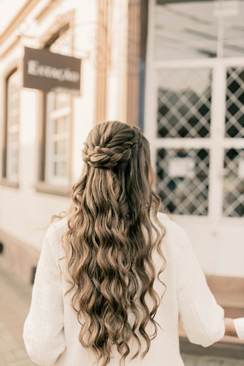 Long wavy half up half down hairstyle from behind