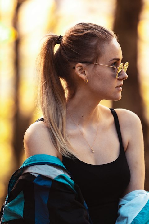 High wavy ponytail hairstyle with sunglasses