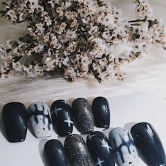 Black press-on nails with Halloween designs