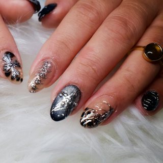 Black and silver nail art designs on almond nails